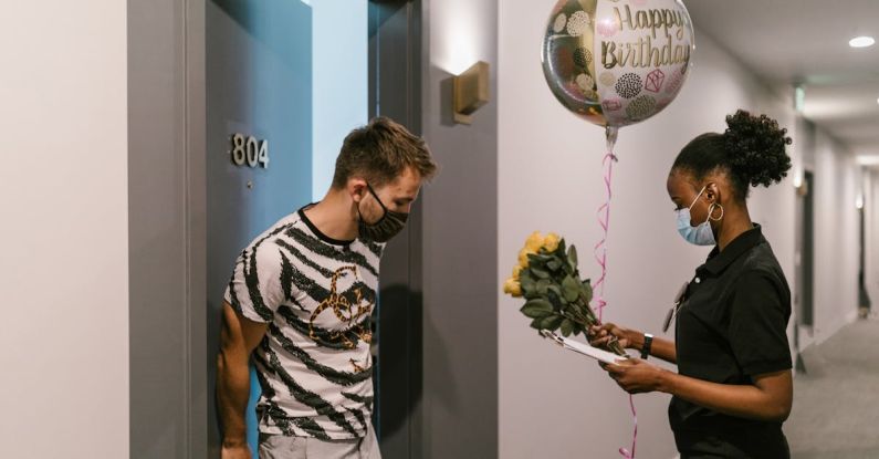 Balloon Job - A Deliverywoman Delivering a Balloon and a Bouquet of Flowers