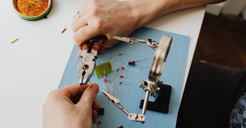 Resume Magnifying Glass - Hands of Person Assembling Transistors with Use of Magnifying Glass