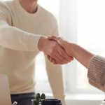 Hands Deal - Man and Woman Near Table