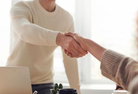 Hands Deal - Man and Woman Near Table