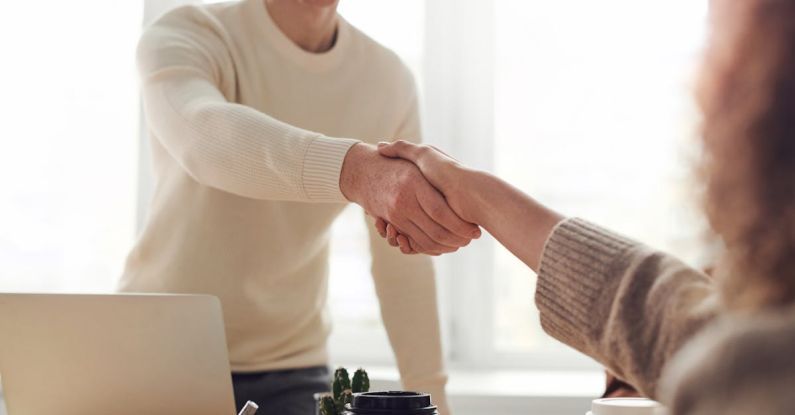 Hands Deal - Man and Woman Near Table
