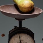 Scales Clock - Yellow and Red Round Fruit on Brown and White Weighing Scale
