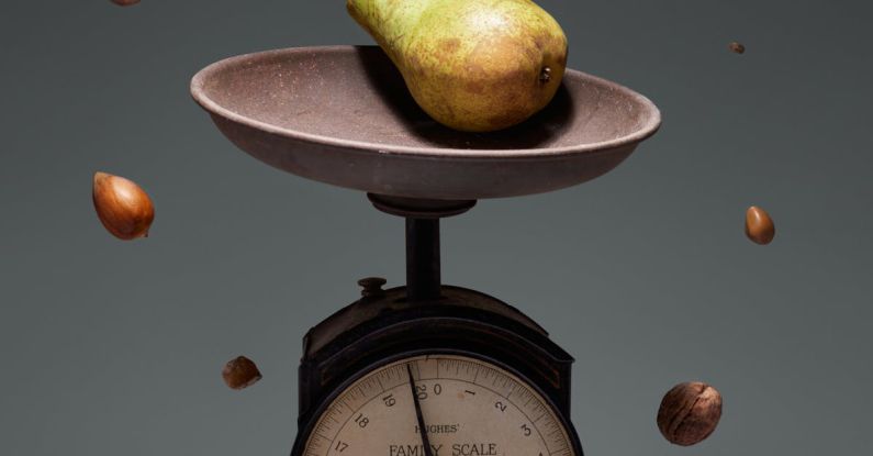 Scales Clock - Yellow and Red Round Fruit on Brown and White Weighing Scale