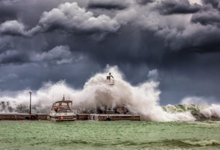 Boat Storm - Big Waves Under Cloudy Sky