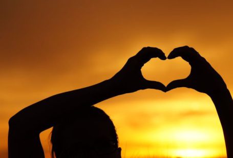 Hands Heart - Silhouette Woman Hand Holding Heart Shape Against Orange Sky