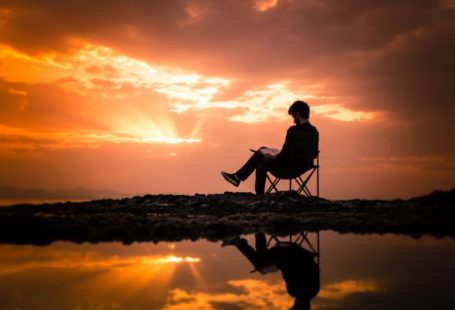 Chair Sunset - Photo of Man Sitting on Camping Chair During Dawn