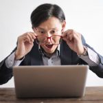 Puzzle Portrait - Amazed formal male looking at laptop screen