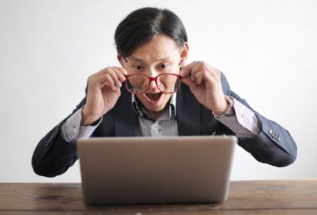 Puzzle Portrait - Amazed formal male looking at laptop screen
