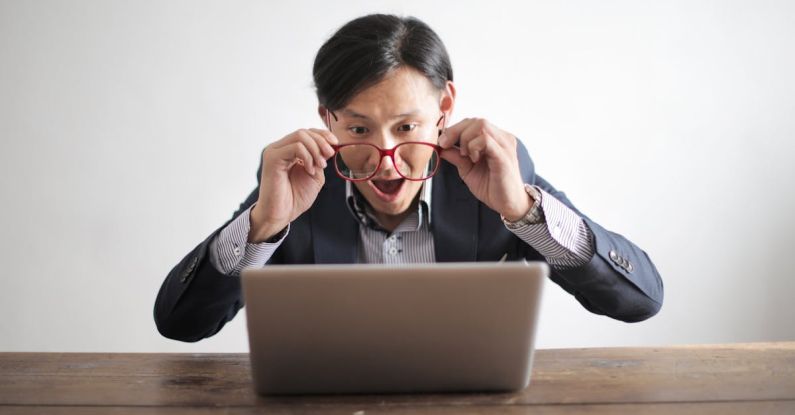 Puzzle Portrait - Amazed formal male looking at laptop screen