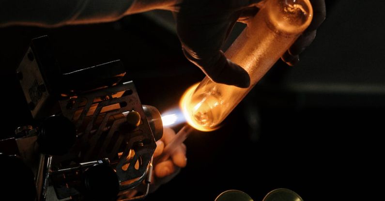 Torch Hand - Person Burning Glass on a Torch