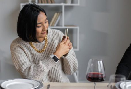 Chain Digital - Content ethnic woman taking photo on smartphone