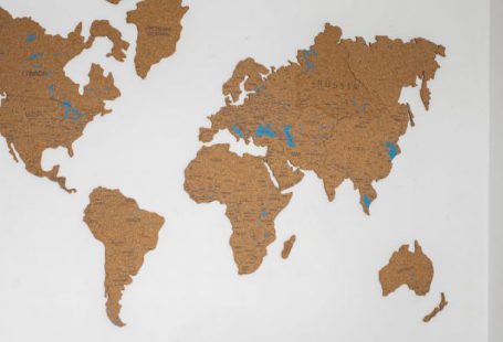 Computer World - Laptop near decorative world continents