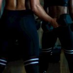 Mirror Body - Woman Lifting Two Dumbells on Both Hands in Front of Mirror