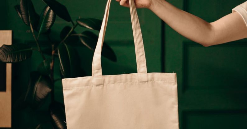 Shopping Bag Planet - Person Holding White Tote Bag