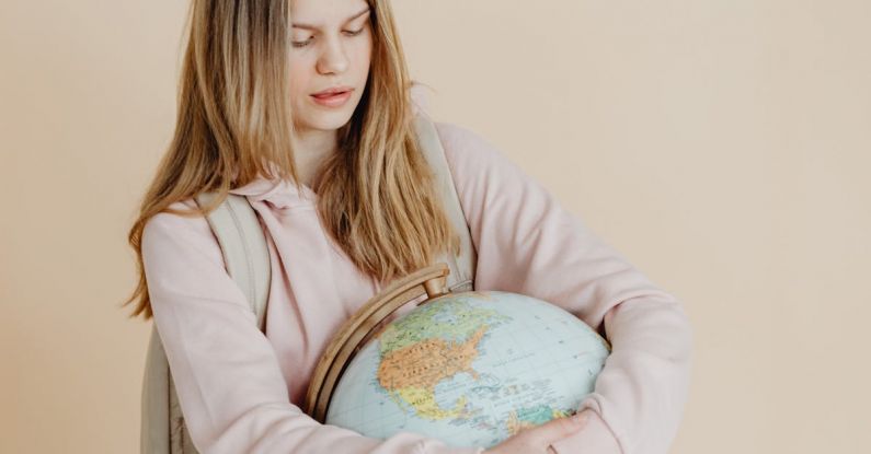 Backpack Globe - A Teenager Hugging a Globe