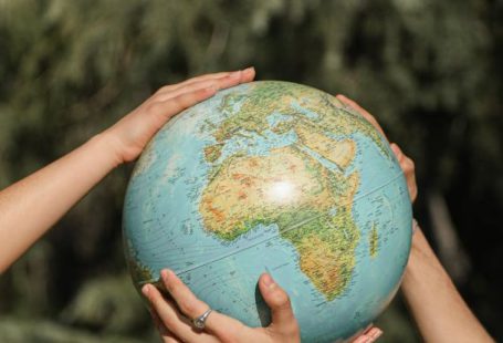 Hands Earth - People Holding a Globe