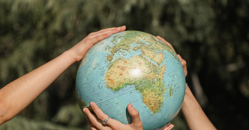 Hands Earth - People Holding a Globe