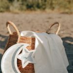 Moon Pillow - Woven Basket, Lanterns and Pillow on the Sand