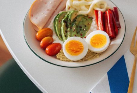 Brain Vegetables - A plate of food with eggs, bacon, and avocado