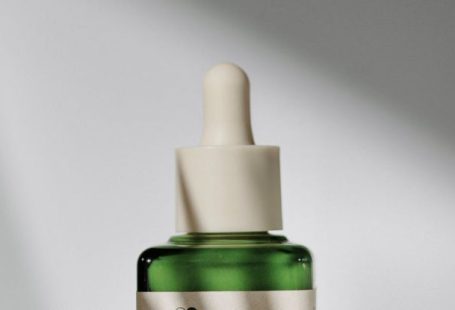 Dna Medicine - A bottle of green oil on a white surface