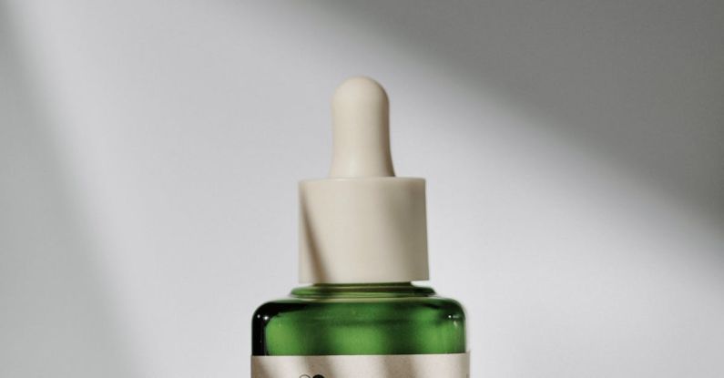 Dna Medicine - A bottle of green oil on a white surface