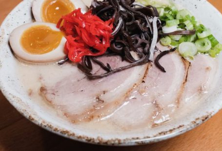 Pills Vegetables - A bowl of ramen with meat, eggs and vegetables