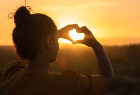 Hands Heart - Woman Sitting While Showing Heart Sign Hands