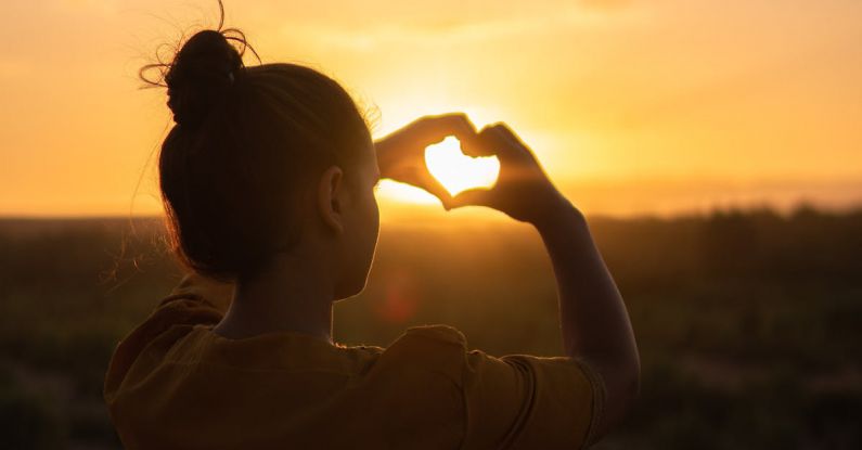 Hands Heart - Woman Sitting While Showing Heart Sign Hands